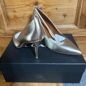 Champagne Coach Heels